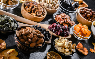 Composition with a variety of dried fruits and assorted nuts.