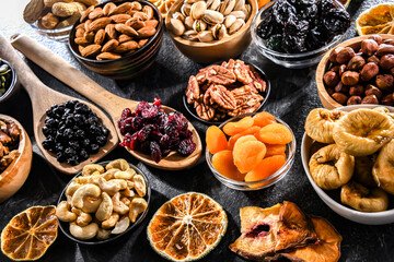Composition with a variety of dried fruits and assorted nuts.