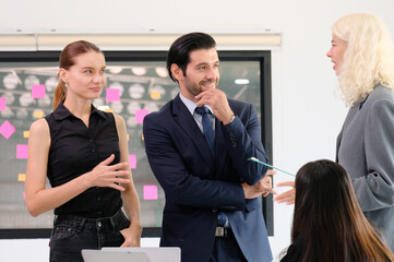 Business people and employees having a meeting in the office.