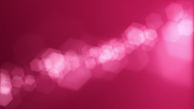 Defocused bokeh lights background. This elegant magenta motion background animation with hexagonal lens blur bokeh particles is full HD and a seamless loop.