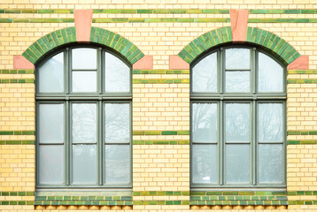 View of beautiful building with green windows