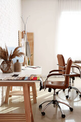 Interior of atelier with workplace and sewing supplies