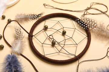 Materials for making dream catcher on beige background, closeup