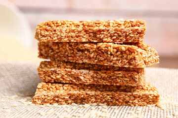 Stack of tasty sesame kozinaki on table
