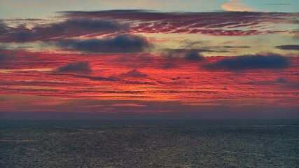 Gorgeous fiery sunset sky above the calm sea on the Ramsgate coast