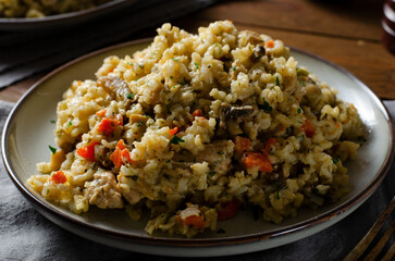 Rice with Mushrooms, Chicken, and Vegetables, Risotto, Comfort Food, Healthy Meal on Rustic Background