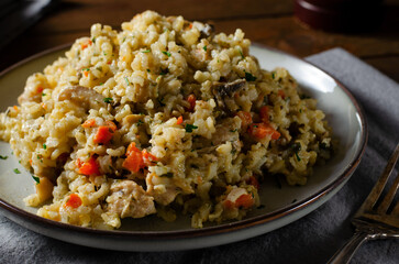 Rice with Mushrooms, Chicken, and Vegetables, Risotto, Comfort Food, Healthy Meal on Rustic Background