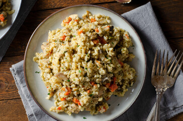 Rice with Mushrooms, Chicken, and Vegetables, Risotto, Comfort Food, Healthy Meal on Rustic Background