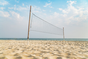empty volleyball net on the tropical beach with blue sky. beach sport.