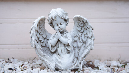 A carved figure of a white angel.