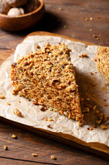 Wafer Cake with Condensed Milk and Nuts, Layered Cake on Wooden Background