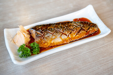 Saba grilled mackerel, Japanese food on a white plate.