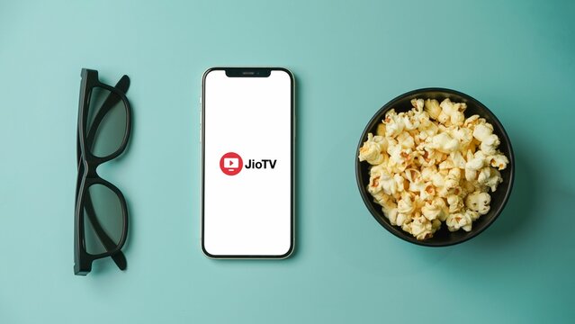 JioTV app on the mobile phone screen, Jio Tv logo on mobile screen