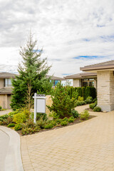 House For Sale. Real Estate Sign in Front of a House. Sold.
