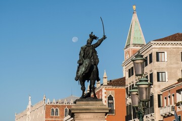 Aerial view of statue surrounded by buildings in Venice