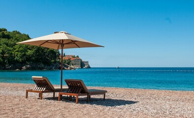 Distant view of the Sveti Stefan island on a sunny day in Montenegro, Balkans