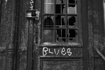 Old damaged wooden door with inscription