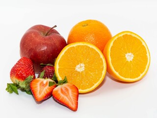 Fototapeta na wymiar Delicious fresh juicy whole and halved fruits isolated on white background