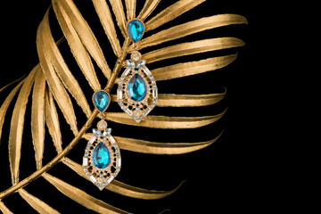 earrings with diamonds isolated on black background.