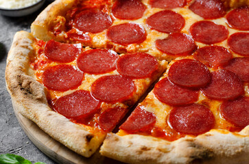 Pepperoni Pizza with Mozzarella Cheese, Salami, Tomato Sauce on Dark Background, Freshly Baked Pizza