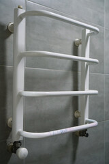 Heated towel rail in bathroom