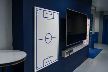 Football or soccer field board in dressing room to discuss tactic