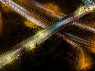 Fototapeta na wymiar Aerial view of an exit ramp of a highway at night