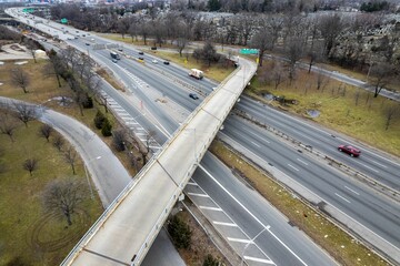 Aerial view of crossing roadways, with lush green grass in a park in Queens, New York