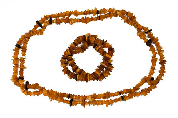 Amber necklace on wooden background
