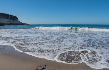 sunny day on a beach, blue  sea and blue sky