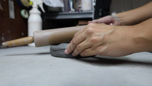 Closeup view of sculpting with clay.