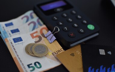 plastic contactless cards, card terminal and euro cash