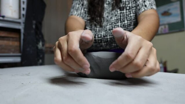 Closeup view of sculpting with clay