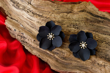beautiful stone earrings on wooden background