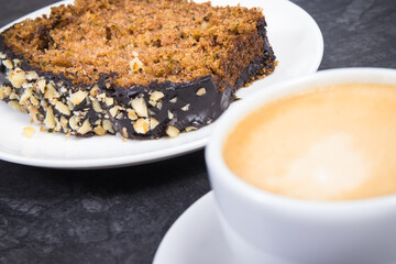 Fresh baked pastry made of zucchini and cup of white coffee. Delicious dessert