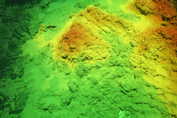 Illuminated kinetic multi-colored sand.