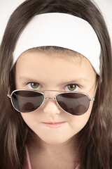 Little girl with sunglasses.