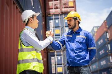 Engineer and Foreman joining hands, Workers Join Hand for Collaboration in the container yard.