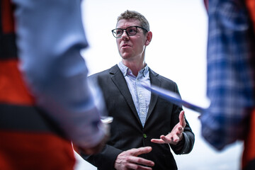 Engineer manager talking with foreman and team, Transport Engineers Teamwork Controlling Management.