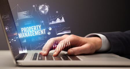 Businessman working on laptop, business concept