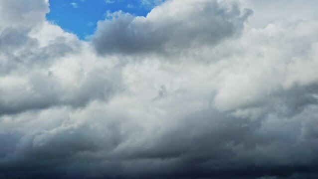 Footage with dramatic sky and dark grey fast moving storm clouds. Stormy cloudy rainy weather timelapse. Nature overcast