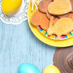Easter table with colored eggs and homemade cookies