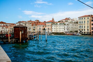 Naklejka premium Beautiful shot of historic buildings on the canal shore in Venice, Italy