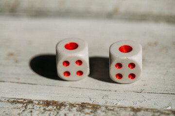 two dice on a wooden table