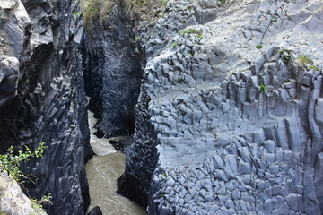 stream bed of river Alcantara flowing through basalt of volcano Etna,Sicily Italy