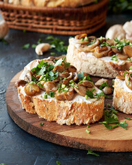 Appetizing bruschetta cream cheese and fried champignon mushrooms. Healthy and nutritious breakfast.