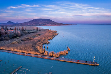Twilight above the harbour of Szigliget on the Lake Balaton, Hungary with the Badacsony Mountain in...