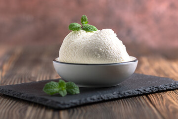 Homemade ricotta cheese close up.