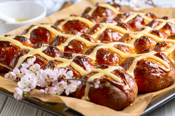 Fresh English cross buns close-up.