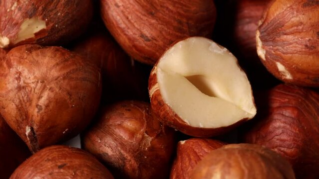 Hazelnuts turning slowly in close up